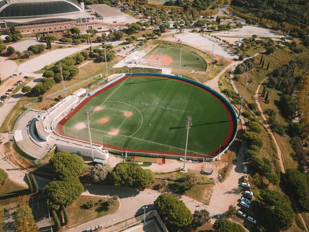 an aerial view of a baseball field in a city